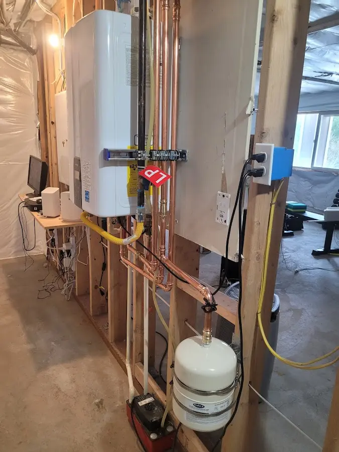 Licensed plumber repairing a kitchen sink in Menominee
